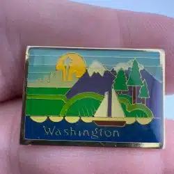 Washington State Travel Pin with Seattle Skyline, Mountains, Trees, and Sailboat