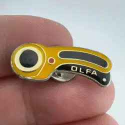 Vintage OLFA Rotary Cutter Lapel Hat Pin *read description*