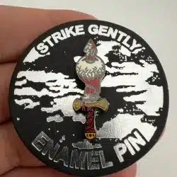 Strike Gently Co Sword Piercing An Eyeball Lapel Hat Pin