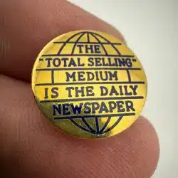 The Total Selling Medium Is The Daily Newspaper Lapel Hat Pin