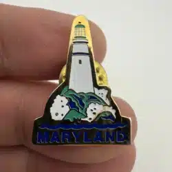 Maryland Lighthouse Lapel Hat Pin with waves splashing at base
