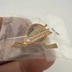 Vintage 1991 Vancouver Canucks Stylized Skate Logo Pin with Crossed Sticks