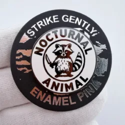 Strike Gently Nocturnal Animal Raccoon with Knife Lapel Pin - Dual Clasp